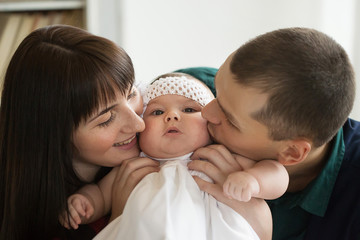 father, mother and child. A married couple with a six-month-old daughter. a family.