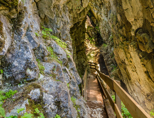 Waterfalls Stanghe (Gilfenklamm) localed near Racines, Bolzano in South Tyrol, Italy. Wooden bridges and runways lead through the canyon and give a spectacular sight to the waterfalls.