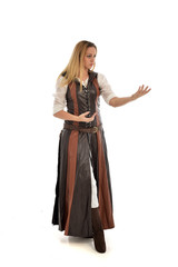 Fototapeta premium full length portrait of girl wearing brown fantasy costume. standing pose on white studio background. 