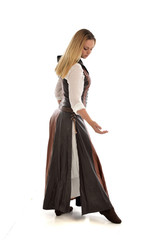 full length portrait of girl wearing brown  fantasy costume. standing pose on white studio background. 