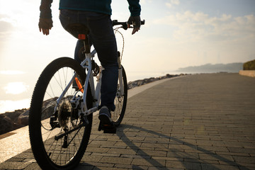 cyclist riding bike in the coasts sunrise sunshine