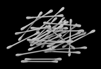 Cotton swabs set isolated on black background, top view