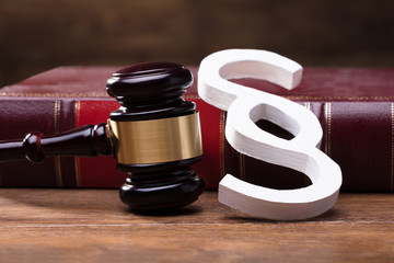 Paragraph Symbol, Mallet And Law Book On Wooden Table