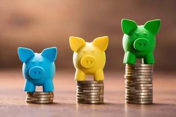 Colorful Piggybank On The Stack Of Coins