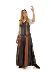 Fototapeta premium full length portrait of girl wearing brown fantasy costume. standing pose on white studio background. 