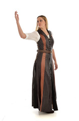 full length portrait of girl wearing brown  fantasy costume. standing pose on white studio background. 