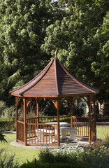 Naklejka premium A pavilion style summer house situated in a large garden