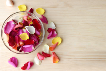 multi colored rose petals in a glass bowl