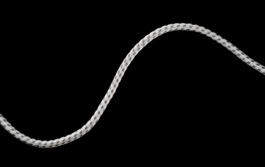 White cable isolated on black background, top view