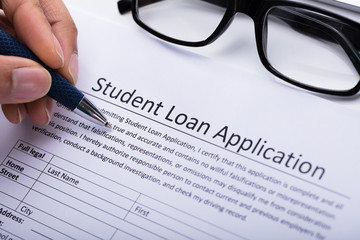 Person Filling Student Loan Application Form