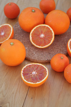 Oranges and Tangerines on wooden background