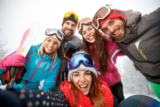 Happy group of skiers on skiing