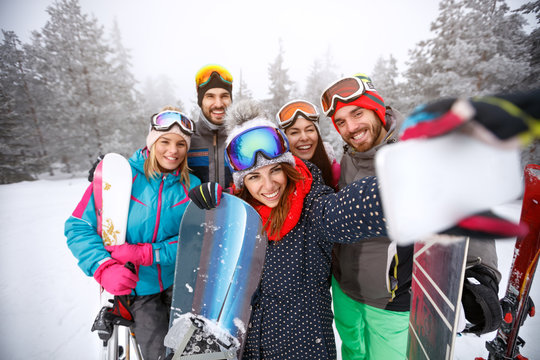 Female taking selfie together on ski terrain