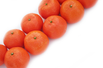 Tangerines in a row isolated on white background