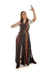 full length portrait of girl wearing brown  fantasy costume. standing pose on white studio background. 