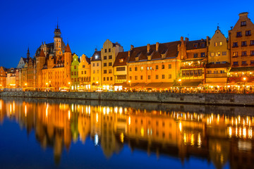 Fototapeta na wymiar Gdansk at night reflected in Motlawa river, Poland