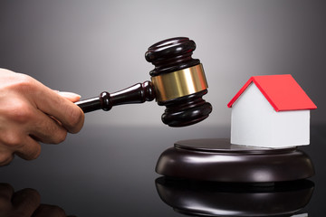 Close-up Of A Judge Striking Gavel