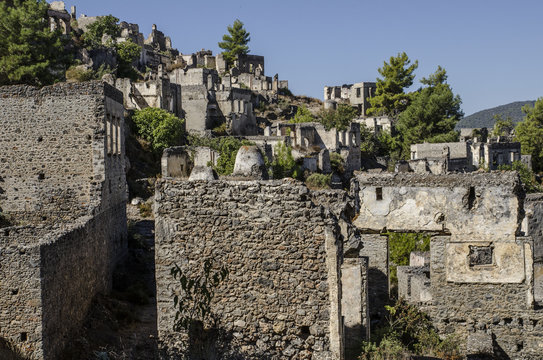 Turkey, the ghost town of Kayakoy, on the slope of the mountain abandoned houses, close-up depicts the walls of the ruined houses