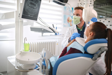 Dentist and patient looking at x-ray dental footage