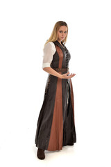 full length portrait of girl wearing brown  fantasy costume. standing pose on white studio background. 
