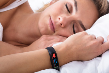 Fitness Activity Tracker On Woman's Hand