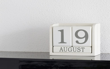 White block calendar present date 19 and month August