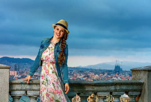 happy traveller woman against cityscape of Barcelona, Spain