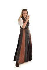 Fototapeta premium full length portrait of girl wearing brown fantasy costume. standing pose on white studio background. 