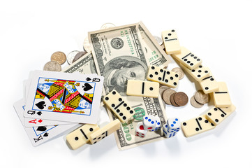 Cards, dice, dominoes and money on a white background
