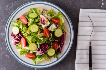 Fresh salad with cucumber and tomatoes.
