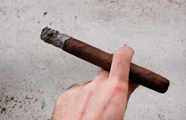 Man hand holding cigar