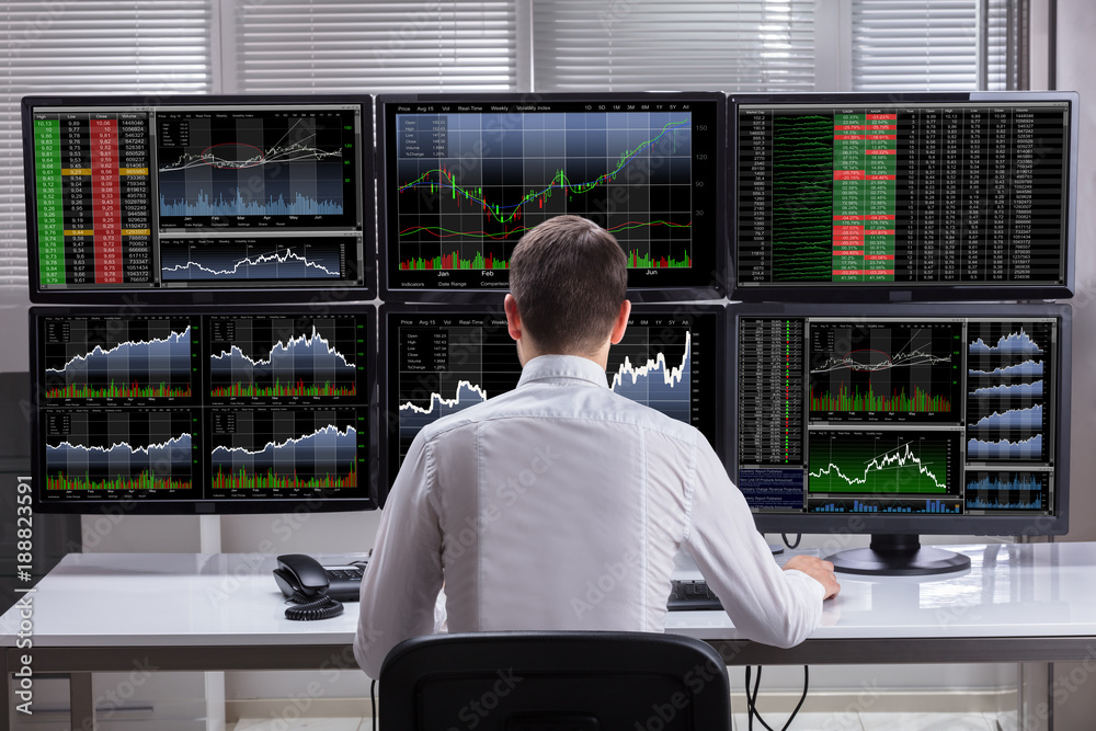 Poster stock market broker analyzing graphs on computer screens