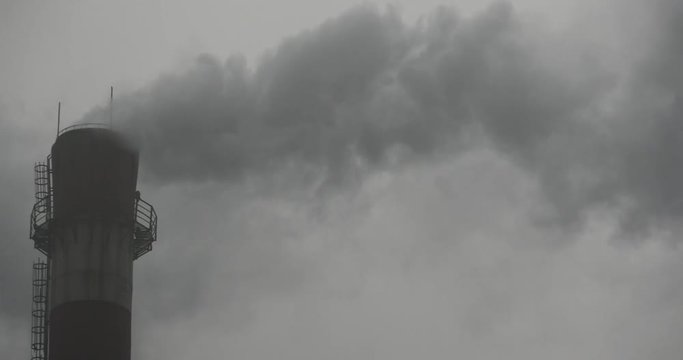 4k fumes billow from industry chimney,energy generation pipe with smoke.