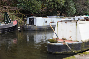 Fototapeta na wymiar detail of narrowboats and barges moored on a canal