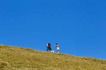 Fototapeta premium Mount Baldo, Italy - August 15, 2017: walking mountain tourism. people climb the mountain.