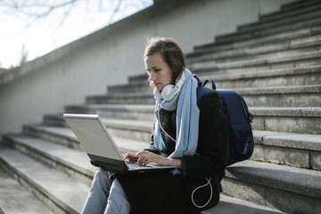 Urban girl using a pc