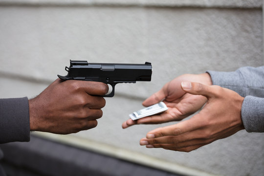 Hand Holding Pistol Handgun Pointing To Victim