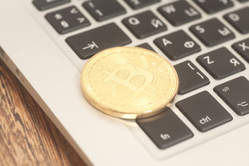 Crypto currency bitcoin coin  on computer keyboard