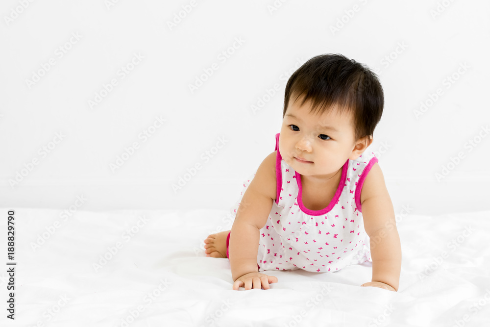 Canvas Prints Portrait of adorable baby girl crawling on the bed, indoors