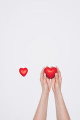 cropped shot of woman with small red hearts isolated on white