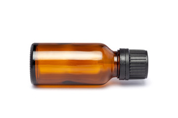 Amber color small pharma grade empty glass bottle with black cap and dropper.