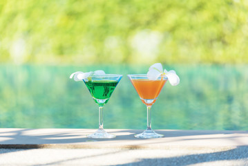 Colorful cocktail with orange by the pool, drink,cocktail,relaxation,trave,llifestyles.