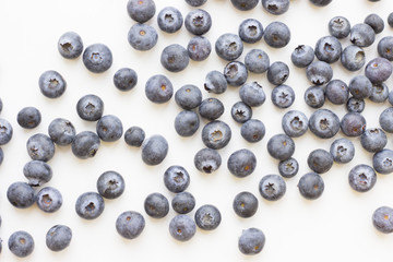 Healthy Fruit Dessert concept with fresh berries. White background with blueberries, close up, top view, copy space