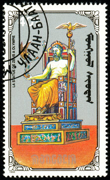 Ukraine - circa 2018: A postage stamp printed in Mongolia show Statue of Zeus. Series: 7 Wonders of the Ancient World. Circa 1990.