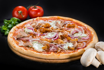 Delicious hot Mushroom Pizza with mozzarella, bacon, champigon, onion, pepper and sauce on wooden round board on dark background