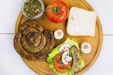homemade sausage and sandwich with sausage, mushrooms and tomato