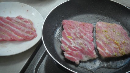 fried tuna steak on the hot pan