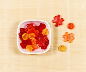 Gummy Bear Candy Colorful Background on wood
