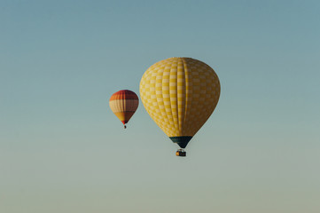Naklejka premium Hot air balloons flying in blue sky