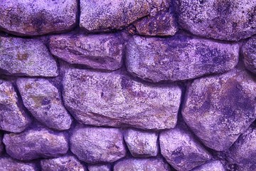 Violet Stone wall for background or rocks rough texture